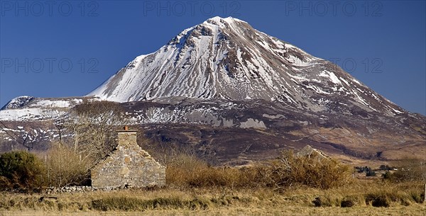 Gweedore, County Donegal, Ireland. Mount Errigal with a dusting of snow. Ireland Irish Eire Erin Europe European Republic Sky Blue Brown Stonework Ruins Old buildings Old buildings Scenic Landscape Tourism Mountain Errigal Errigal Gweedore Snow Capped Destination Destinations Northern Europe Poblacht na hEireann