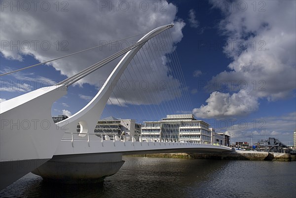 Dublin City, County Dublin, Ireland. Samuel Beckett Bridge over the River Liffey designed by Santiago Calatrava and opened on 10th December 2009. Ireland Irish Eire Erin Europe European County City Urban Dublin Baile Atha Cliath Transport Transportation Bridge River Liffey Samuel Beckett River Water Liffey Capital Blue Clouds Cloud Sky Color Northern Europe Poblacht na hEireann Republic Colour White