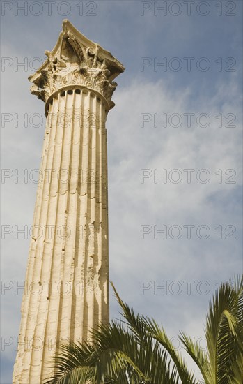 Athens, Attica, Greece. The Temple of Olympian Zeus single corinthian column of ruined temple dedicated to king of the Olympian gods Zeus. Greece Greek Attica Athens Europe European Vacation Holiday Holidays Travel Destination Tourism Ellas Hellenic Acropolis Parthenon Temple Olympian Zeus Ruin Ruins Column Columns Atenas Athenes Blue Clouds Cloud Sky Destination Destinations Ellada History Historic One individual Solo Lone Solitary Southern Europe