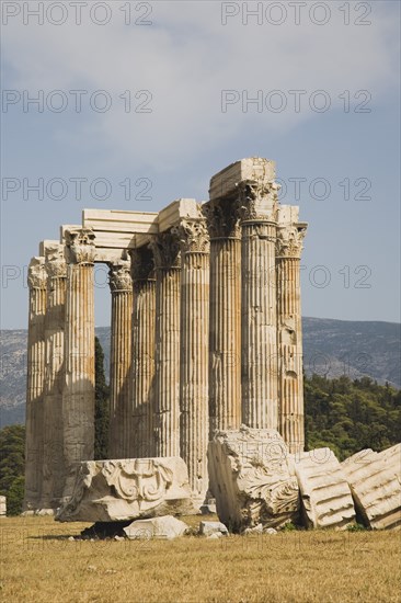 Athens, Attica, Greece. The Temple of Olympian Zeus corinthian columns capitals and architraves of ruined temple dedicated to king of the Olympian gods Zeus. Greece Greek Attica Athens Europe European Vacation Holiday Holidays Travel Destination Tourism Ellas Hellenic Acropolis Parthenon Temple Olympian Zeus Ruin Ruins Column Columns Atenas Athenes Destination Destinations Ellada History Historic Southern Europe