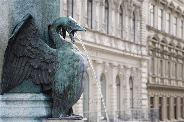 Vienna, Austria. Neubau District. Detail of bronze fountain depicting goose or swan with outstretched wings spouting water from open beak. Austria Austrian Republic Vienna Viennese Wien Europe European City Capital Neubau District Bronze Fountain Water Spout Spouting Destination Destinations Osterreich Viena Western Europe