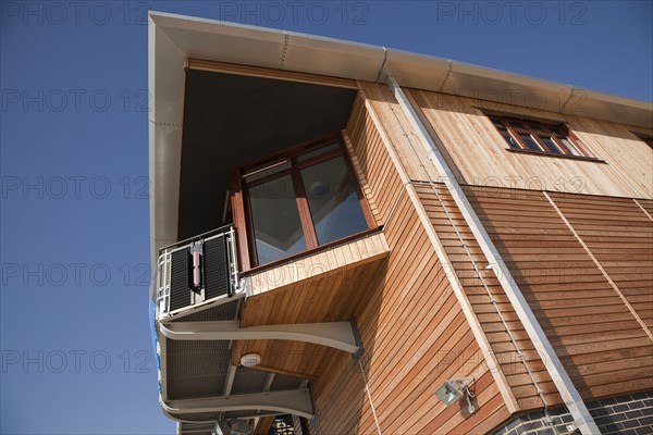 Shoreham-by-Sea, West Sussex, England. Kingston Beach Newly constructed lifeboat house opposite the harbour entrance. England English West Sussex County Shoreham Shoreham-by-Sea by Sea Water Kingston Beach Europe European Architecture Modern Life Boat Lifeboat Lifeboats RNLI Wood Wooden Clad Galvanised Metal Zinc Blue Sky Station Home Timber Frame