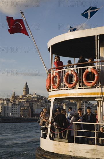 Istanbul, Turkey. Sultanahmet. Crowded passenger ferry flying Turkish flag on the Bosphorous with city behind. Since March 2006 Istanbuls traditional commuter ferries have been operated by Istanbul Sea Buses. Turkey Turkish Istanbul Constantinople Stamboul Stambul City Europe European Asia Asian East West Urban Sultanahmet Bosphorous Destination Travel Tourism Transport Water Ship Boat Ferry Commuter Cummuters Classic Classical Destination Destinations Historical Middle East Older South Eastern Europe Turkiye Water Western Asia