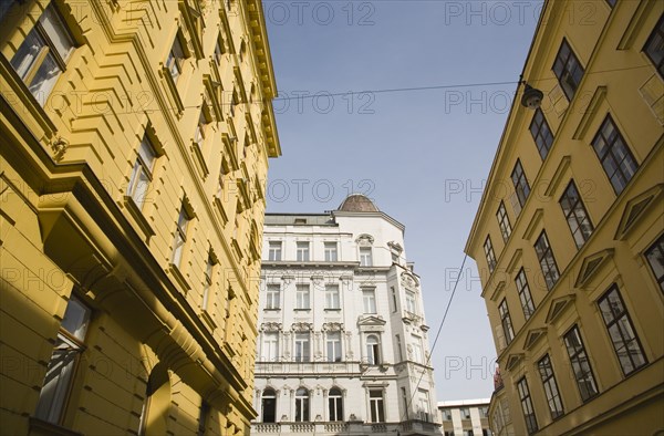 Vienna, Austria. White and yellow painted exterior facades of restored buildings. Austria Austrian Republic Vienna Viennese Wien Europe European City Capital Architecture Buildings Street Exterior Facade Yellow White Restored Renovated Color Destination Destinations Osterreich Viena Western Europe