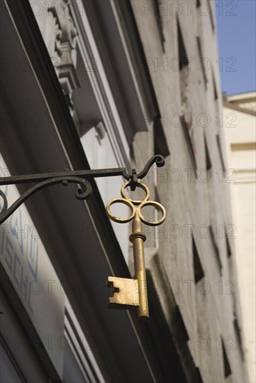 Vienna, Austria. Hanging shop sign in the shape of a key. Austria Austrian Republic Vienna Viennese Wien Europe European City Capital Sign Signs Shop Store Architecture Key Destination Destinations Osterreich Signs Display Posted Signage Viena Western Europe