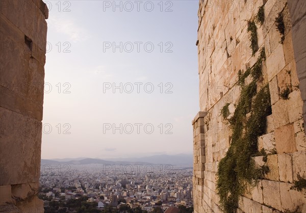 Athens, Attica, Greece. Acropolis Propylaea gate and view over city looking north. Greece Greek Europe European Vacation Holiday Holidays Travel Destination Tourism Ellas Hellenic Attica Athens Acropolis Ruin Ruins Column Columns Proplaea Gate Atenas Athenes Destination Destinations Ellada History Historic Northern Southern Europe