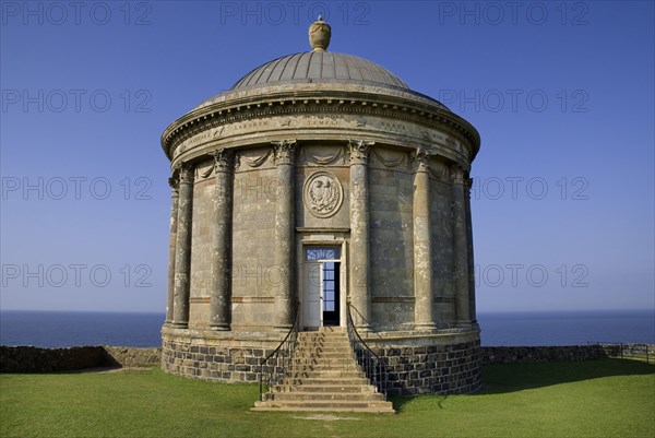 Mussenden Temple, County Derry, Ireland. Built as a library and modelled on the Temple of Vesta in Italy. Ireland Irish Eire Erin Europe European North Northern Derry Londonderry Mussenden Temple Library Architecture Folly Follie Blue Sky Color Destination Destinations Gray History Historic Italia Italian Northern Europe Poblacht na hEireann Republic Southern Europe Colour Grey