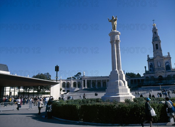 Fatima, Beira Litoral, Portugal. Golden Statue of Christ with church in background Portuguese Religion Southern Europe