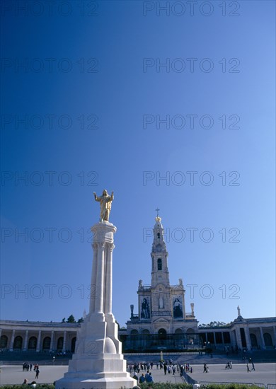 Fatima, Beira Litoral, Portugal. Golden Statue of Christ with church in background Portuguese Religion Southern Europe