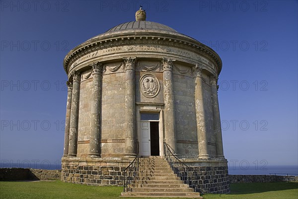 Mussenden Temple, County Derry, Ireland. Built as a library and modelled on the Temple of Vesta in Italy. Ireland Irish Eire Erin Europe European North Northern Derry Londonderry Mussenden Temple Library Architecture Folly Follie Blue Sky Color Destination Destinations Gray History Historic Italia Italian Northern Europe Poblacht na hEireann Republic Southern Europe Colour Grey