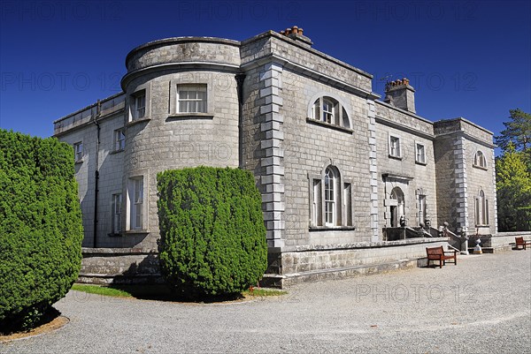 Belvedere House, County Westmeath, Ireland. General view of the facade of the house which was built in 1740. Ireland Irish Eire Erin Europe European County West Meath Westmeath Belvedere House Gardens Facade Exterior Architecture Blue Sky Mansion Stately Grand Color Destination Destinations Garden Plants Flora Gray Northern Europe Poblacht na hEireann Republic Colour Gardens Plants Grey