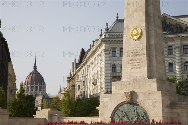Budapest, Pest County, Hungary. WWII memorial with Hungarian Parliament Building behind. Hungary Hungarian Europe European East Eastern Buda Pest Budapest City Architecture Buildings Parliament WWII World War Two Memorial 2 Destination Destinations Eastern Europe History Historic Parliment