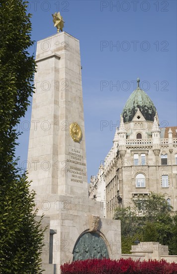 Budapest, Pest County, Hungary. WWII memorial with Art Nouveau building facade behind. Hungary Hungarian Europe European East Eastern Buda Pest Budapest City Architecture Buildings WWII World War Two Memorial Art Nouveau Facade Blue Sky 2 Destination Destinations Eastern Europe History Historic