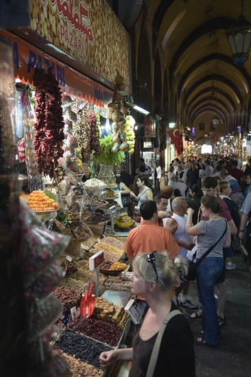 Istanbul, Turkey. Sultanahmet. The Spice Bazaar or Egyptian Bazaar one of the oldest bazaars in the city and the second largest covered shopping complex after the Grand Bazaar. Turkey Turkish Istanbul Constantinople Stamboul Stambul City Europe European Asia Asian East West Urban Destination Travel Tourism Spice Bazaar Bazaar Market Shop Store Stall Interior Crowd Crowded Shoppers Tourists 1 Destination Destinations Holidaymakers Middle East Shops Shoppers Mall Retail Buy Buying Market Markets Single unitary South Eastern Europe Turkiye Western Asia