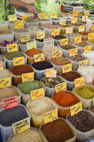 Kusadasi, Aydin Province, Turkey. Stall at weekly market selling spices and chili powders in brightly coloured display. Turkey Turkish Eurasia Eurasian Europe Asia Turkiye Aydin Province Kusadasi Market Markets Stall Display Spice Spices Powder Tea Dried Multi Muliple Color Colour Colors Colours Colored Coloured Chilli Destination Destinations European Middle East South Eastern Europe Western Asia