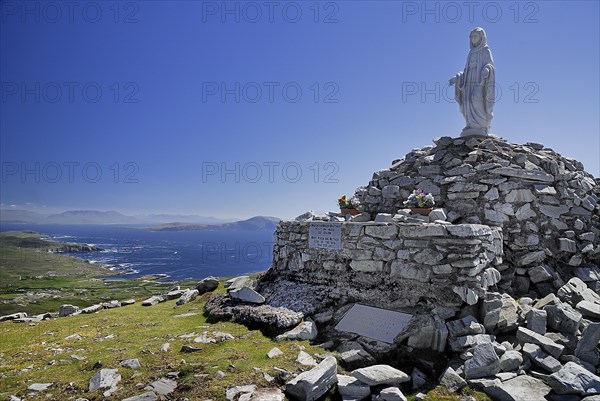 Achill Island, County Mayo, Ireland. Minaun Cliffs Statue of Blessed Virgin Mary on summit of the cliffs. Ireland Irish Eire Erin Europe European County Mayo Achill Island Minaun Cliff Cliffs Statue Mary Virgin White Religion Religious Christian Christianity Blue Sky Landscape Blue Sky Cliffs Drop Steep Overlooking Color Cultural Cultures Destination Destinations Gray Northern Europe Order Fellowship Guild Club Poblacht na hEireann Religion Religious Christianity Christians Republic Scenic Colour Grey