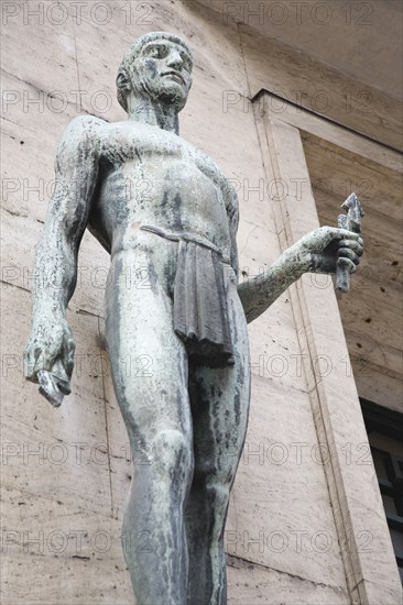 Budapest, Pest County, Hungary. Art Nouveau bronze standing figure at apartment entrance. Hungary Hungarian Europe European East Eastern Buda Pest Budapest City Art Nouveau Bronze Metal Statue Figure Male Architecture Buildings Entrance Detail Destination Destinations Eastern Europe Flat