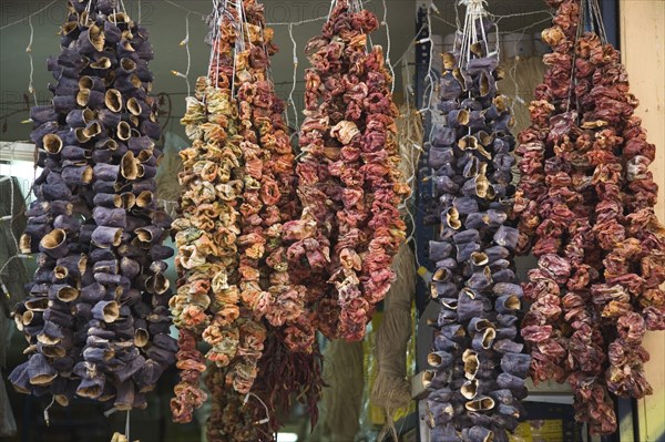 Athens, Attica, Greece. Chili peppers Capsicum annuum cultivars hung up to dry. Greece Greek Europe European Vacation Holiday Holidays Travel Destination Tourism Ellas Hellenic Attica Athens Market Dry Dried Goods Food Display Hanging Capsicmu Capsicums Chili Chilli Chillie Chilis Chillis Chillies Pepper Peppers Annum Cultivars Red Atenas Athenes Destination Destinations Ellada Southern Europe