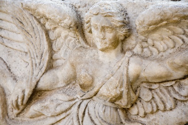 Selcuk, Izmir Province, Turkey. Ephesus. Detail of bas relief carving of the Goddess Nike on column in the antique city of Ephesus on the Aegean sea coast. Asian Destination Destinations European History Historic Middle East South Eastern Europe Turkish Turkiye Water Western Asia