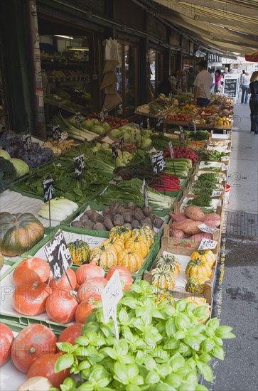 Vienna, Austria. The Naschmarkt. Display of fresh fruit vegetables and herbs for sale outside shopfront under awning. Austria Austrian Republic Vienna Viennese Wien Europe European City Capital Naschmarkt Market Display Stall Store Shop Fruit Herbs Veg Vegetable Vegetables Fresh Food Destination Destinations Osterreich Viena Western Europe