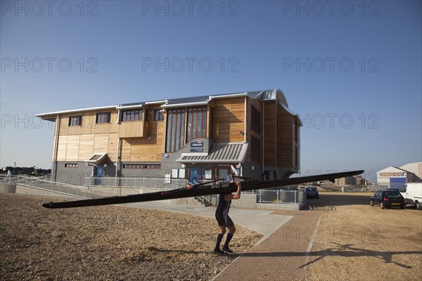 Shoreham-by-Sea, West Sussex, England. Kingston Beach Newly constructed lifeboat house opposite the harbour entrance. England English West Sussex County Shoreham Shoreham-by-Sea by Sea Water Kingston Beach Europe European Architecture Modern Life Boat Lifeboat Lifeboats RNLI Wood Wooden Clad Galvanised Metal Zinc Blue Sky Station Home Timber Frame