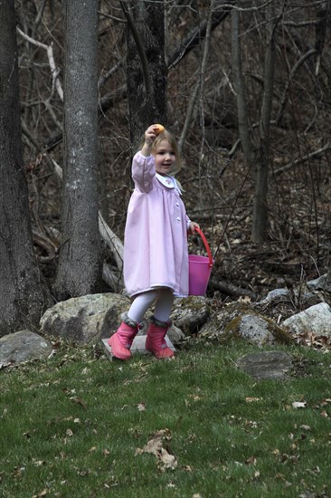 Young girl Sarah Bleau taking part in Easter egg hunt in Keene New Hampshire. Festival Festivals Religion Religious Christian Christianity Easter Egg Eggs Hunt Hunting Young Girl Sarah Bleau MR Model Release Released Model Keene NH New Hampshire USA United States State America American Immature Kids New Hampshire Live Free or Die Granite State North America Northern One individual Solo Lone Solitary Religion Religious Christianity Christians United States of America