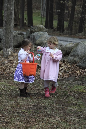 Young girls Kylan Stone and Sarah Bleau hunting for Easter eggs in Keene New Hampshire. Festival Festivals Religion Religious Christian Christianity Easter Egg Hunt Hunting Young Girl Sarah Bleau Kylan Stone MR Model Release Released Model Keene NH New Hampshire USA United States State America American Immature Kids New Hampshire Live Free or Die Granite State North America Northern Religion Religious Christianity Christians United States of America
