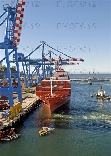 Valparaiso, Chile. Container ship at the busy container port of this UNESCO World Heritage city. Chile Chilean South America American Hispanic Santiago City Urban Transport Port Harbour Dock Ship Boat Container Crane Cranes UNESCO Hertiage Site Water Sea Ocean Latin America Latino Paradise Valley South America Southern Valpo Water