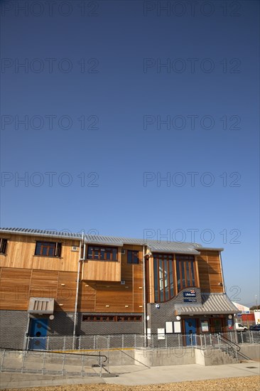 Shoreham-by-Sea, West Sussex, England. Kingston Beach Newly constructed lifeboat house opposite the harbour entrance. England English West Sussex County Shoreham Shoreham-by-Sea by Sea Water Kingston Beach Europe European Architecture Modern Life Boat Lifeboat Lifeboats RNLI Wood Wooden Clad Galvanised Metal Zinc Blue Sky Station Home Timber Frame