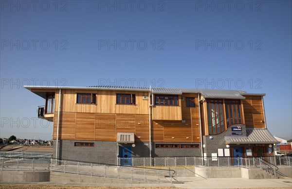 Shoreham-by-Sea, West Sussex, England. Kingston Beach Newly constructed lifeboat house opposite the harbour entrance. England English West Sussex County Shoreham Shoreham-by-Sea by Sea Water Kingston Beach Europe European Architecture Modern Life Boat Lifeboat Lifeboats RNLI Wood Wooden Clad Galvanised Metal Zinc Blue Sky Station Home Timber Frame