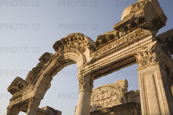 Selcuk, Izmir Province, Turkey. Ephesus. Detail of carved archway and supporting columns in antique city of Ephesus on the Aegean sea coast Turkey Turkish Eurasia Eurasian Europe Asia Turkiye Izmir Province Selcuk Ephesus Ruin Ruins Roman Column Columns Facde Ancient Architecture Masonry Rock Stone Arch Destination Destinations European History Historic Middle East South Eastern Europe Water Western Asia