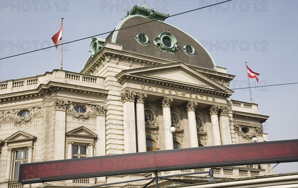 Vienna, Austria. Neubau District. Digital ticker sign outside the Volkstheater exterior facade and entrance. Austria Austrian Republic Vienna Viennese Wien Europe European City Capital Sign Signs Ticker digital Neubau District Volkstheater Architecture Exterior Facade Destination Destinations Osterreich Signs Display Posted Signage Viena Western Europe