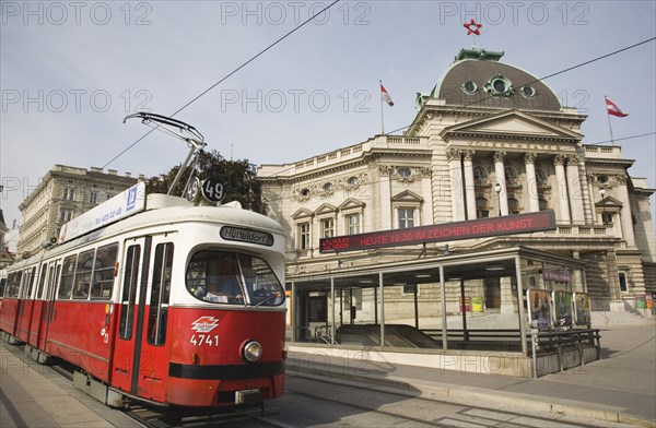 Vienna, Austria. Neubau District. Early model Wiener Linien Tram outside The Volkstheater with digital ticker sign displaying information above entrance to metro station behind. Austrian Color Destination Destinations European Osterreich Signs Display Posted Signage Viena Western Europe