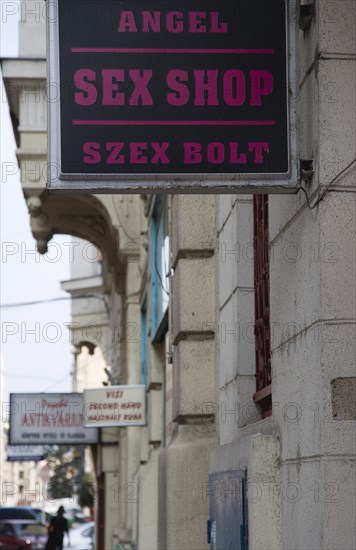Budapest, Pest County, Hungary. Sign for sex shop at the rail terminus Budapest Nyugati palyaudvar. Hungary Hungarian Europe European East Eastern Buda Pest Budapest City Sign Sex Shop Store Nyugati Palyaudvar Angel Eastern Europe Signs Display Posted Signage