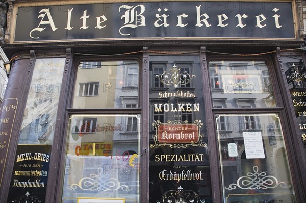 Vienna, Austria. Part view of exterior facade of restaurant with traditional signage. Austria Austrian Republic Vienna Viennese Wien Europe European City Capital Architecture Building Exterior Facade Traditional Sign Signs Sinage Restaurant Classic Classical Destination Destinations Historical Older Osterreich Signs Display Posted Signage Viena Western Europe