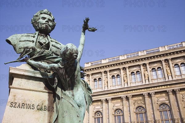 Budapest, Pest County, Hungary. Bronze portrait bust of Szarvas Gabor in front of the Hungarian Academy of Sciences. Hungary Hungarian Europe European East Eastern Buda Pest Budapest City Art Architecture Bronze Metal Statue Exterior Facade Academy Science Szarvas Gabor Blue Sky Destination Destinations Eastern Europe