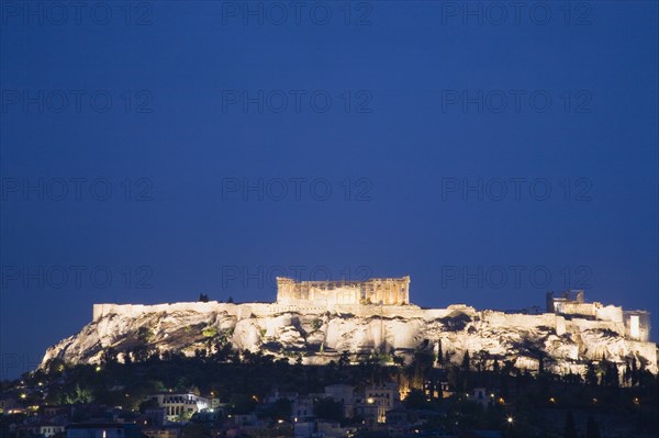 Athens, Attica, Greece. View towards the Acropolis illuminated at dusk. Greece Greek Europe European Vacation Holiday Holidays Travel Destination Tourism Ellas Hellenic Attica Athens City Acropolis Ruin Ruins Night Nighttime Illuminated Lit Lit-up Lights Atenas Athenes Destination Destinations Ellada History Historic Nightfall Twilight Evenfall Crespuscle Crespuscule Gloam Gloaming Nite Southern Europe