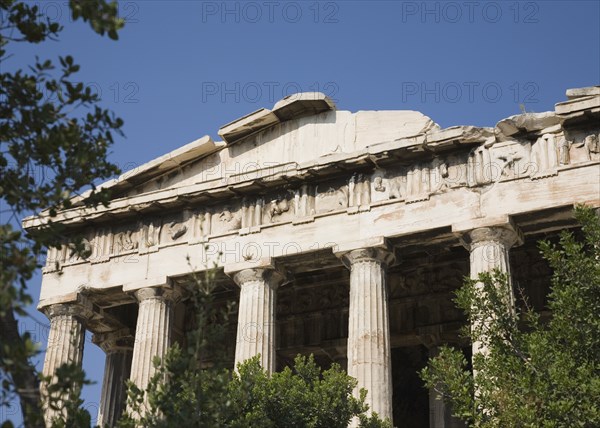 Athens, Attica, Greece. Part view of ruined portico and columns of eastern face of the Temple of Hephaestus. Greece Greek Attica Athens Temple Hephaestus Tourist Europe European Vacation Holiday Holidays Travel Destination Tourism Ellas Hellenic Ancient Ruin Ruins Column Columns Portico Blue Sky Atenas Athenes Destination Destinations Ellada History Historic Sightseeing Southern Europe Tourists