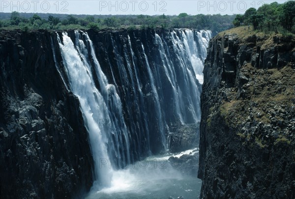 Victoria Falls, Zimbabwe. Zambezi River plunging into gorge. African Eastern Africa Scenic Zimbabwean