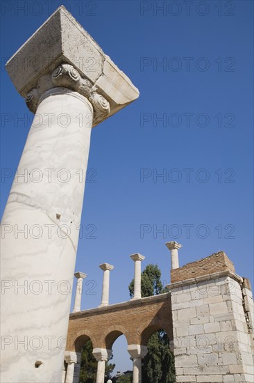 Selcuk, Izmir Province, Turkey. Partially reconstructed wall of the 6th century Basilica of St. John the Apostle with marble column in foreground. Turkey Turkish Eurasia Eurasian Europe Asia Turkiye Izmir Province Selcuk Basilica St Saint John Apostle Ruin Restored Restored Reconstructed Destination Destinations European History Historic Middle East South Eastern Europe Western Asia