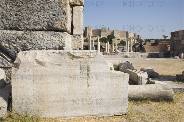 Selcuk, Izmir Province, Turkey. Ruins of the 6th century Basilica of St. John the Apostle with piece of inscribed stone and fallen masonry in foreground. Turkey Turkish Eurasia Eurasian Europe Asia Turkiye Izmir Province Selcuk St Saint John Apostle Basilica Ruin Ruins Destination Destinations European History Historic Middle East South Eastern Europe Western Asia