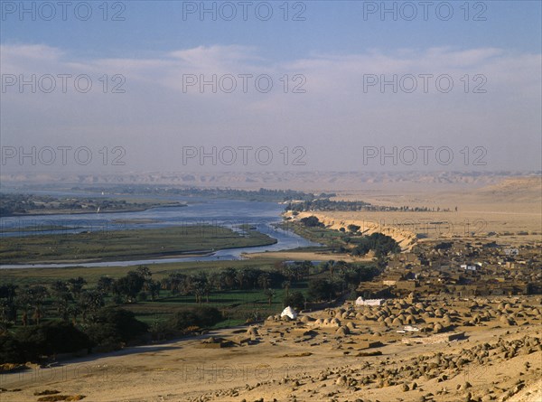 Beni Hasan, Nile Valley, Egypt. View over Muslim cemetery toward the River Nile African Islam Middle East Moslem North Africa Religion Religion Religious Muslims Islam Islamic