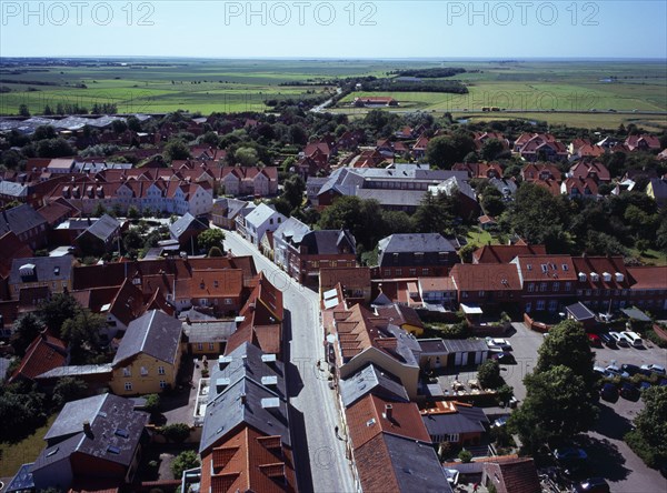 Denmark, Jutland, Ribe, View south-west over city rooftops and cobbled street towards farmland from the twelth century Domkirke tower.