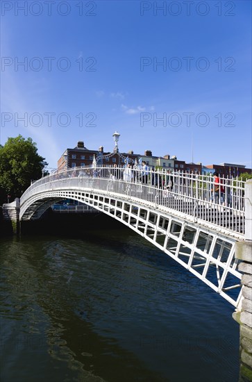 Ireland, County Dublin, Dublin City, The 1816 cast iron Ha Penny or Half Penny Bridge across the River Liffey.