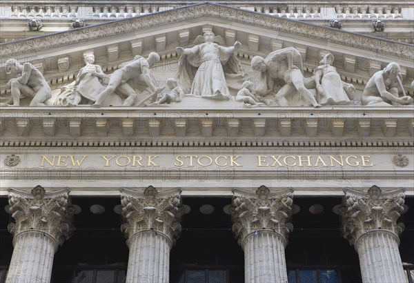 USA, New York, New York City, Manhattan  The New York Stock Exchange building in Broad Street beside Wall Street showing the main facade of the building featuring marble sculpture by John Quincy Adams Ward in the pediment called Integrity Protecting the W