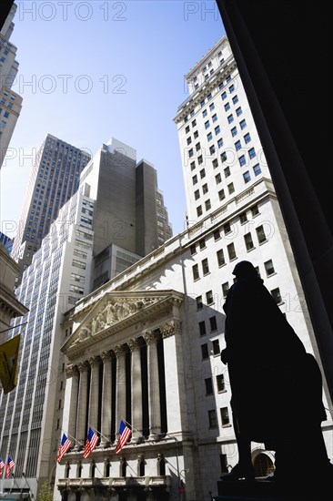USA, New York, New York City, Manhattan  The New York Stock Exchange building in Broad Street beside Wall Street showing the main facade of the building featuring marble sculpture by John Quincy Adams Ward in the pediment called Integrity Protecting the W