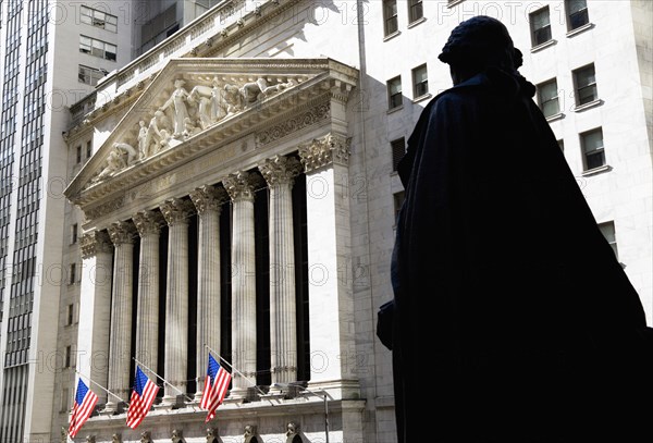 USA, New York, New York City, Manhattan  The New York Stock Exchange building in Broad Street beside Wall Street showing the main facade of the building featuring marble sculpture by John Quincy Adams Ward in the pediment called Integrity Protecting the W