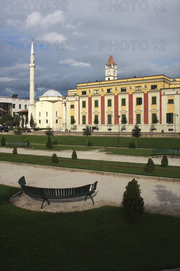 Albania, Tirane, Tirana, Government Buildings and Ethem Bey Mosque on Skanderbeg Square with formal gardens in foreground.