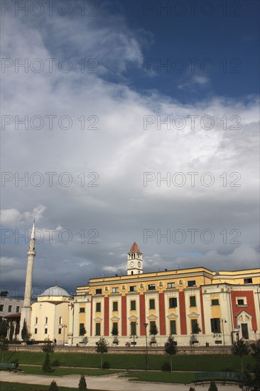 Albania, Tirane, Tirana, Exterior facade of government buildings and Ethem Bey Mosque on Skanderbeg Square.