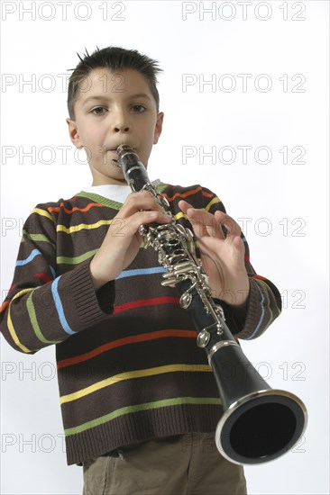 Music, Instrument, Woodwind, A schoolboy playing the clarinet. Cropped to three-quarter view facing camera.
